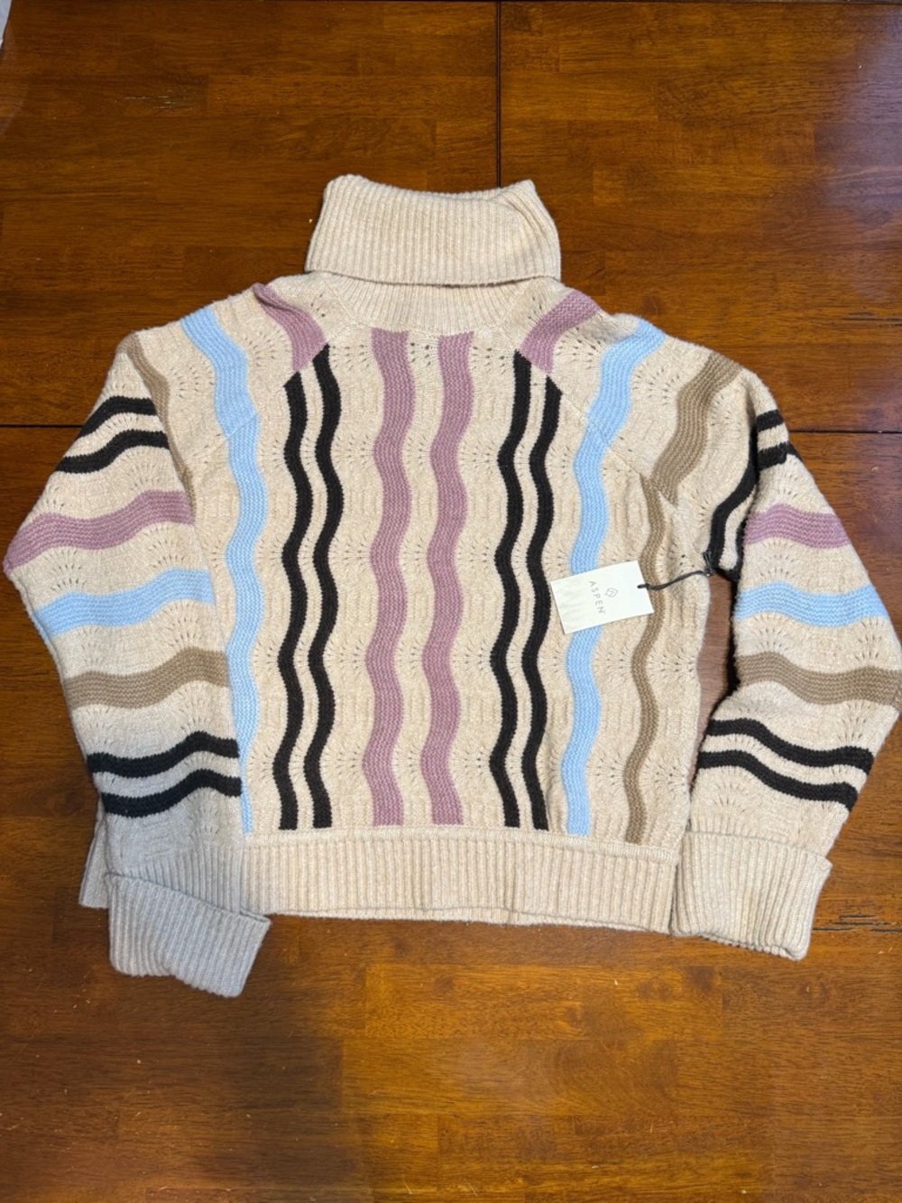 Cream Cable-Knit Turtleneck Sweater with Pastel Wave Stripes